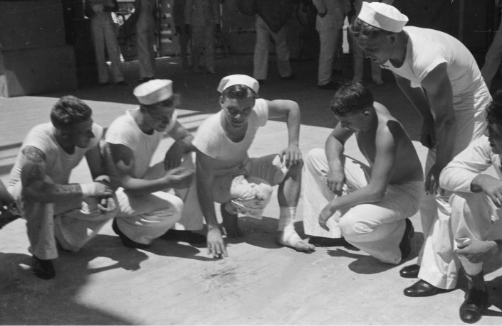 Shanghai (China), wounded sailor and others inspecting deck of U.S.S. Augusta